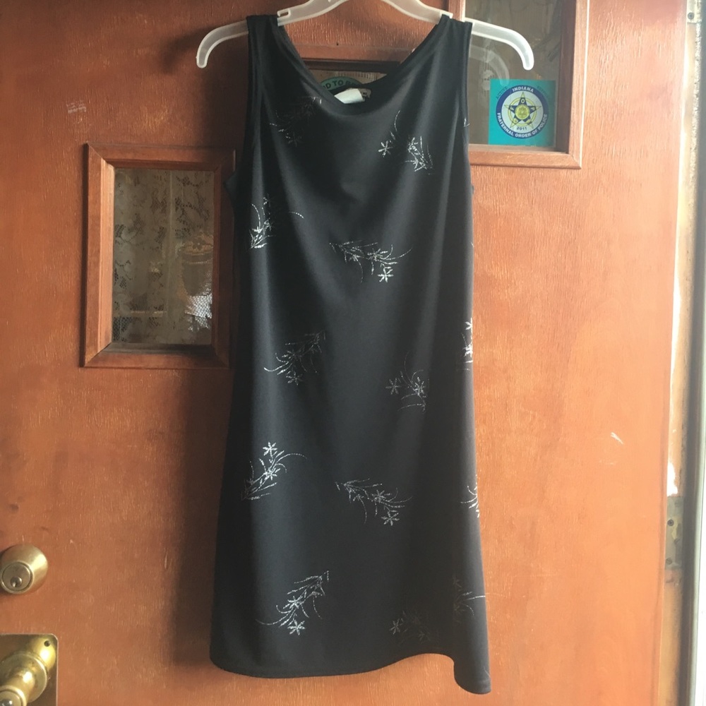 Black dress, dressy, silver flower design.