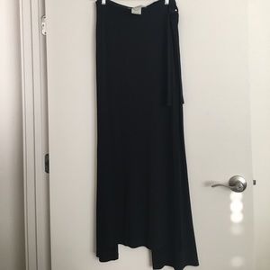 Black stretchy rayon wide leg pants w skirt flap