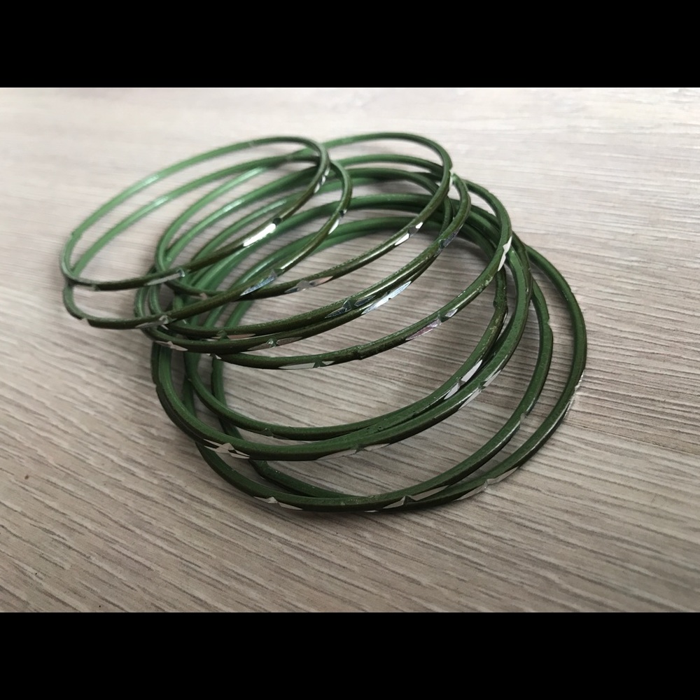 Set of 11 green bangles