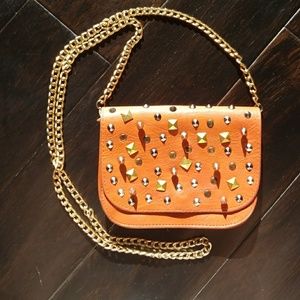 Studded orange faux leather shoulder bag