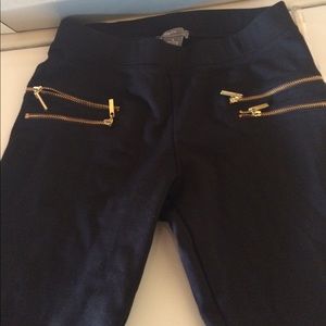 Black pants with zippers.