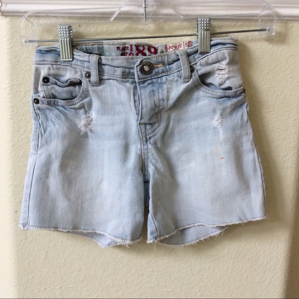 Light denim distressed shorts for girls