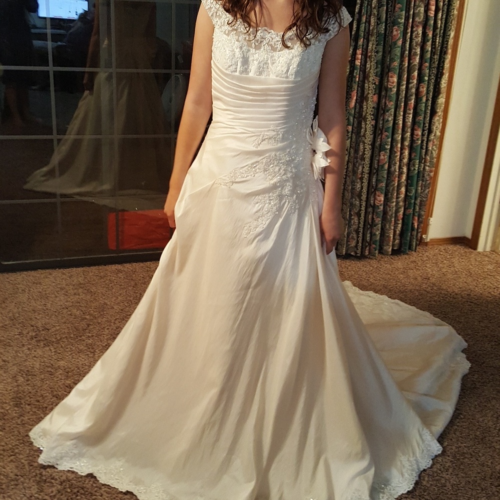 Brand new Private Collection wedding dress