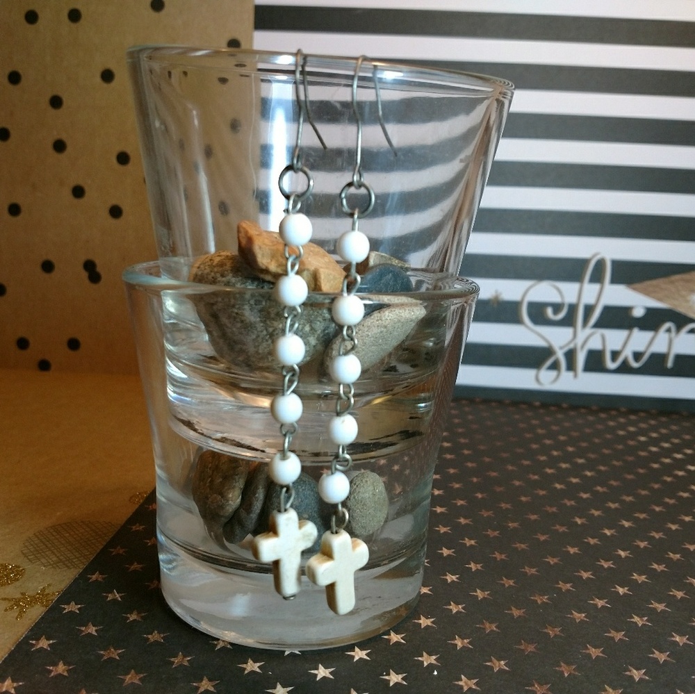 White bead and cross dangles