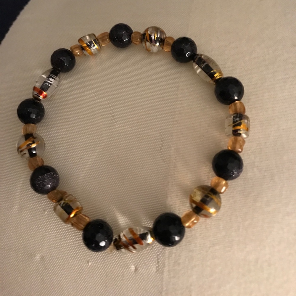 7 1/2" black and gold bracelet.