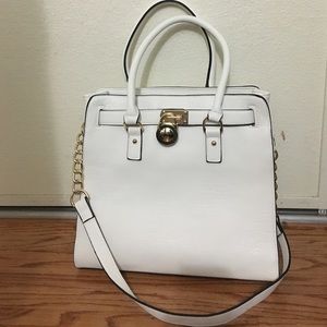 White hand/shoulder tote with gold metal details