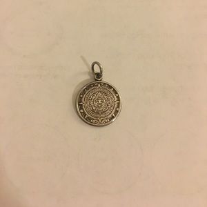 Aztec calendar charm from Mexico