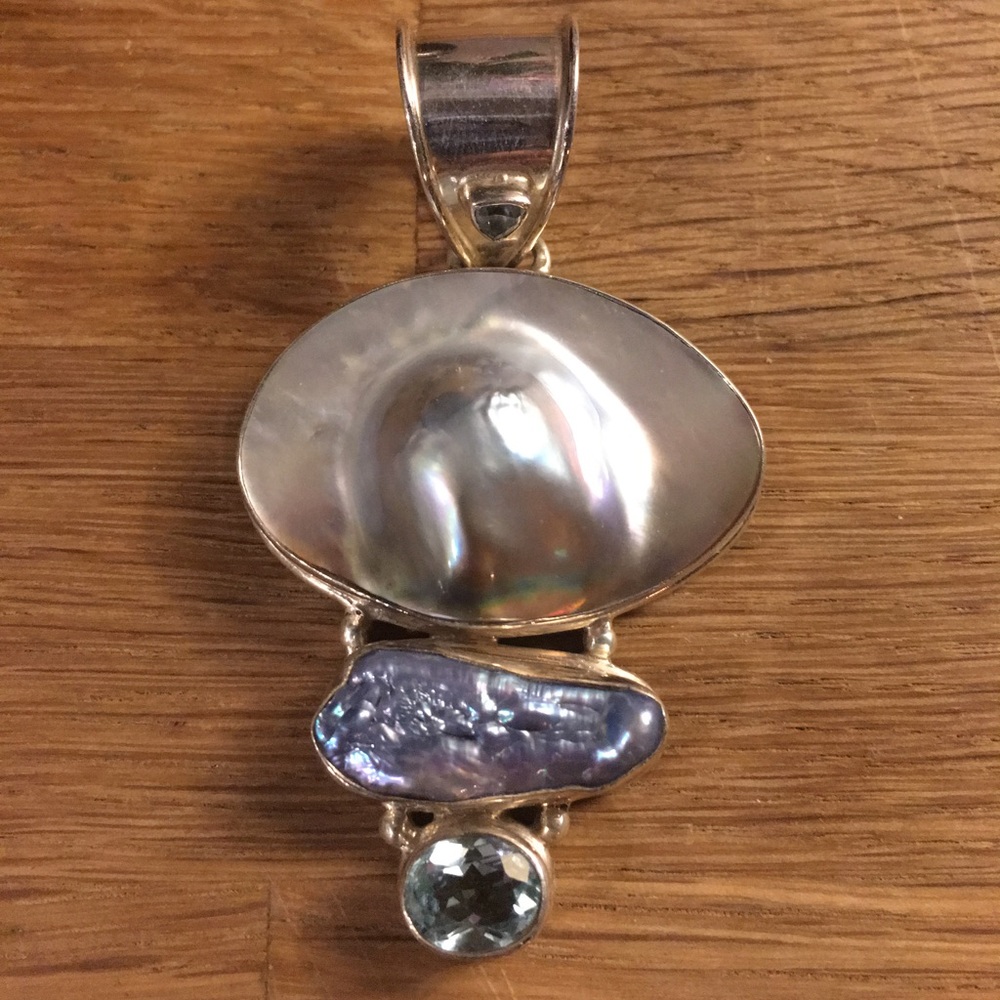 Large mother of pearl and topaz pendant in silver