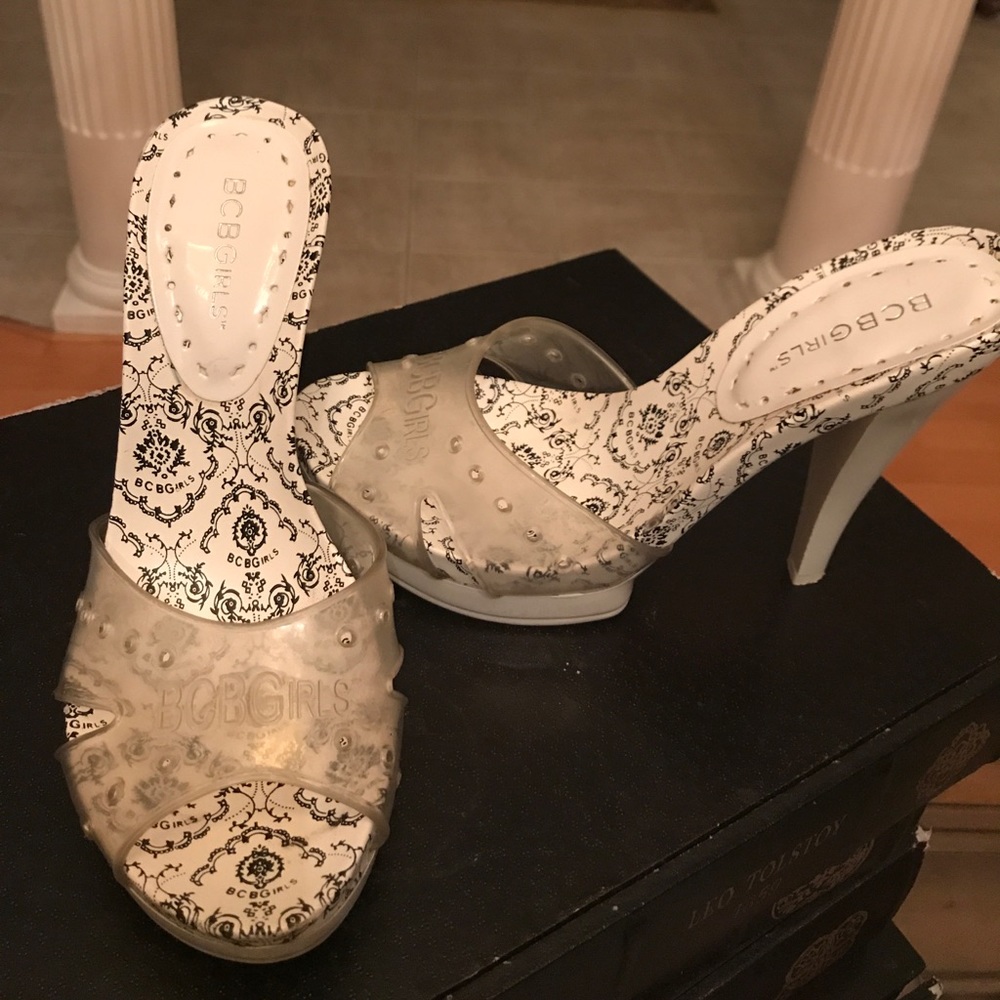 Clear and white black heels