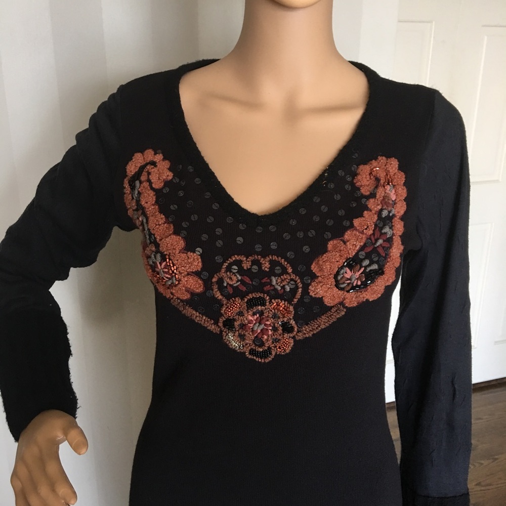 Women's sweater with sequins and beading.