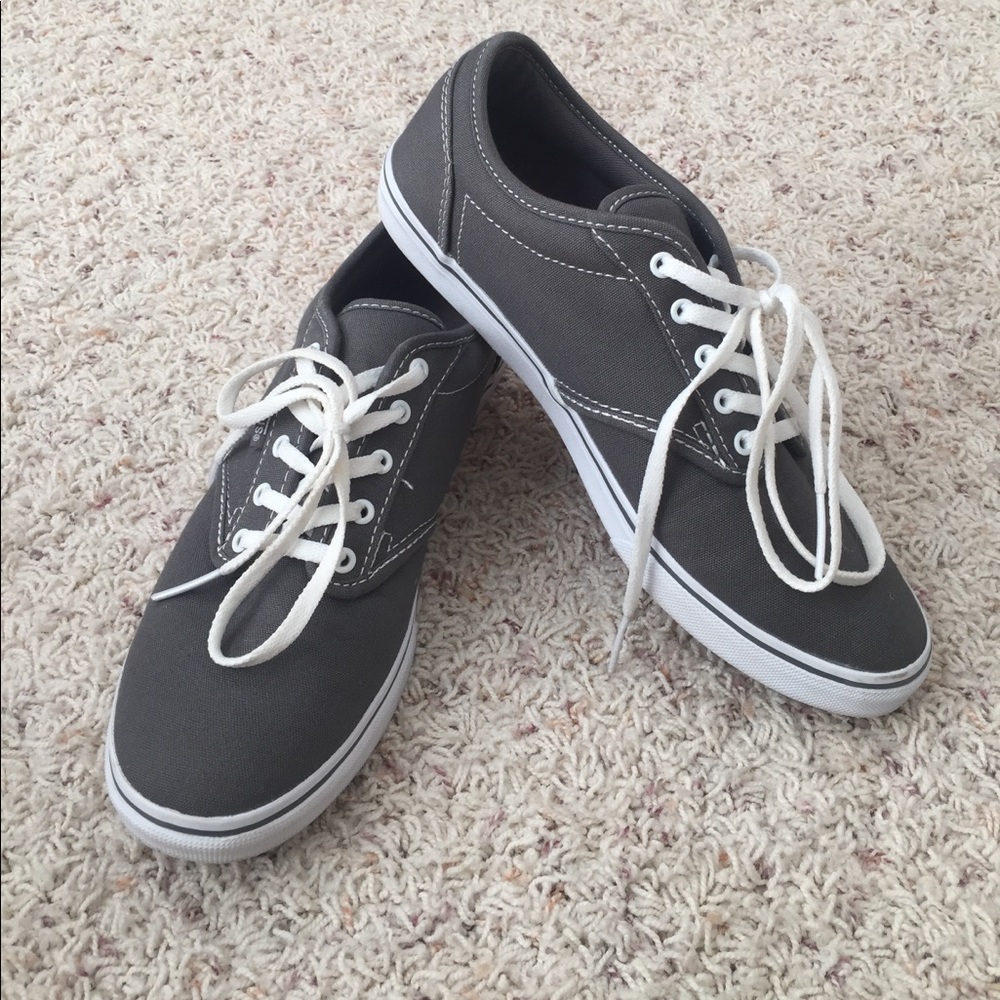 Grey vans with white laces