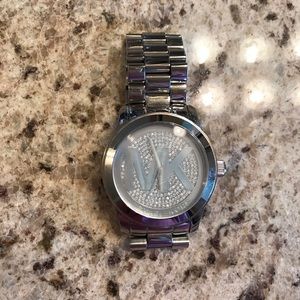 Silver oversized MK watch with rhinestone face.