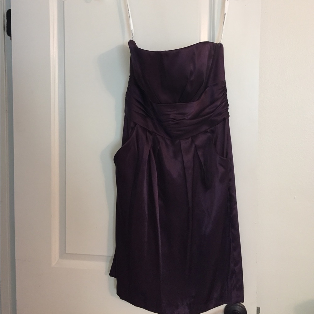 Formal strapless purple dress with pockets.