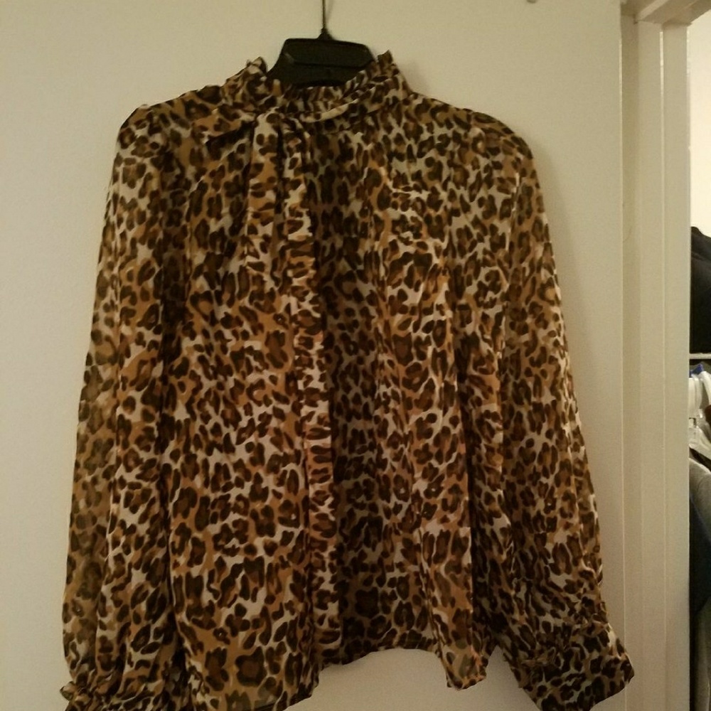 Animal print ruffle tie neck shirt