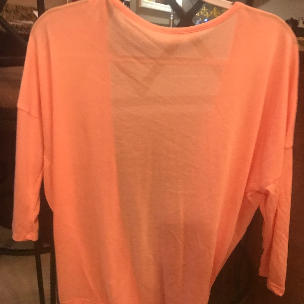Coral/ pink colored top
