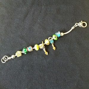 Silver tone bracelet with garden theme beads