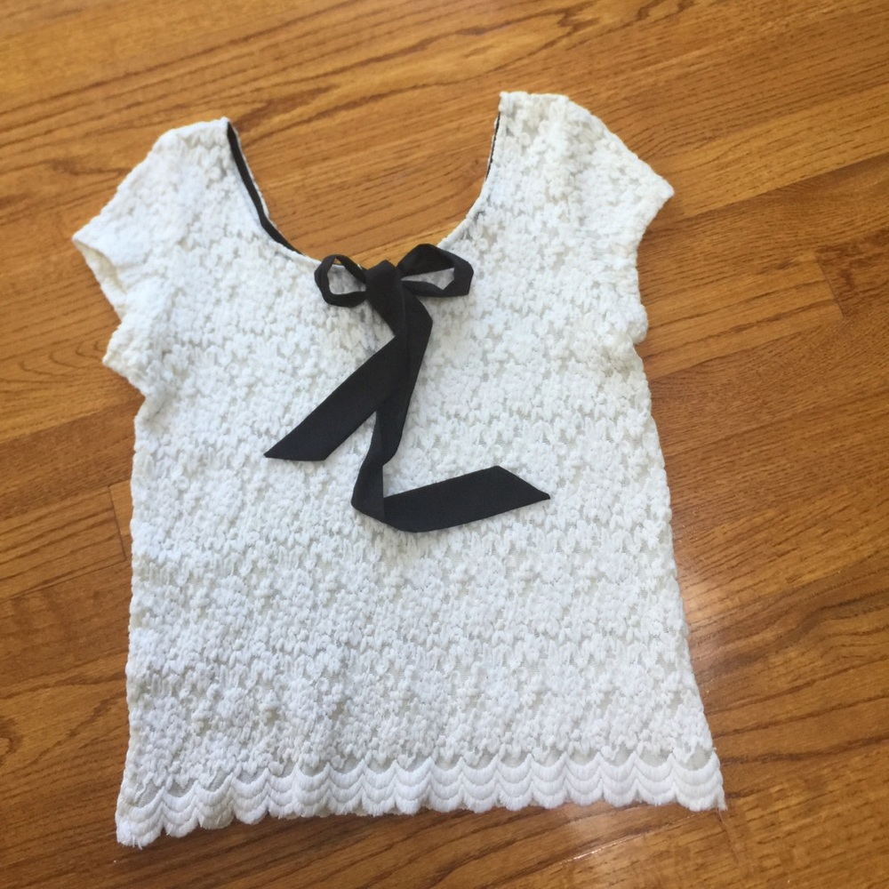 White lace spandex top with black bow in the back