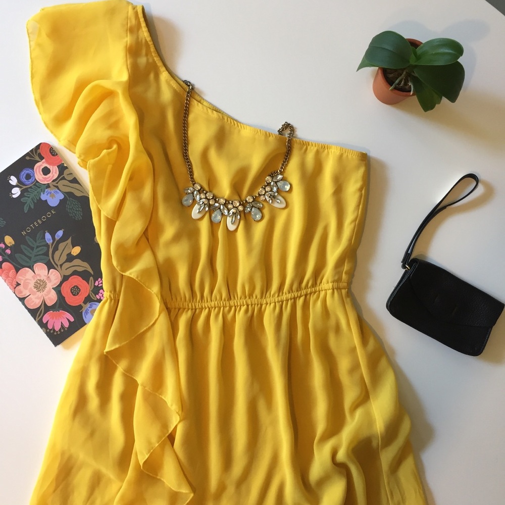 Mustard yellow one shoulder dress.