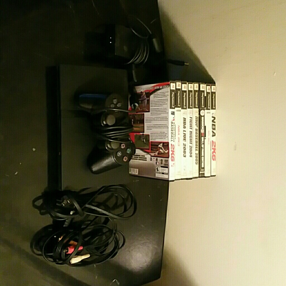 Playstation 2 console & controllers & games cords