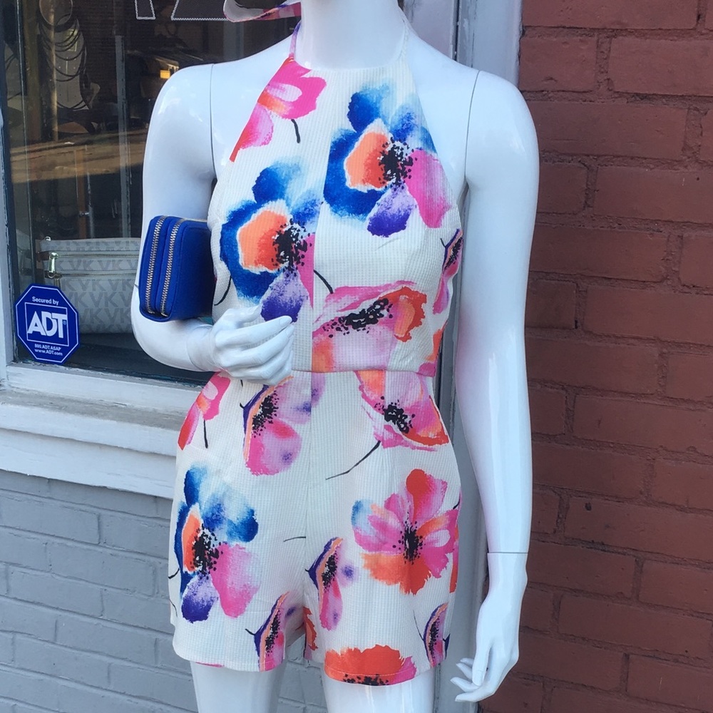 White romper with colorful flowers