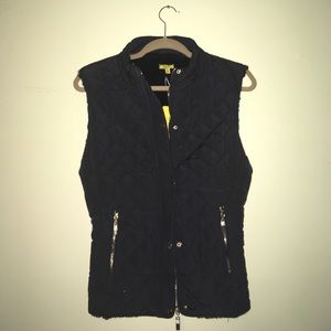 Black quilted vest.
