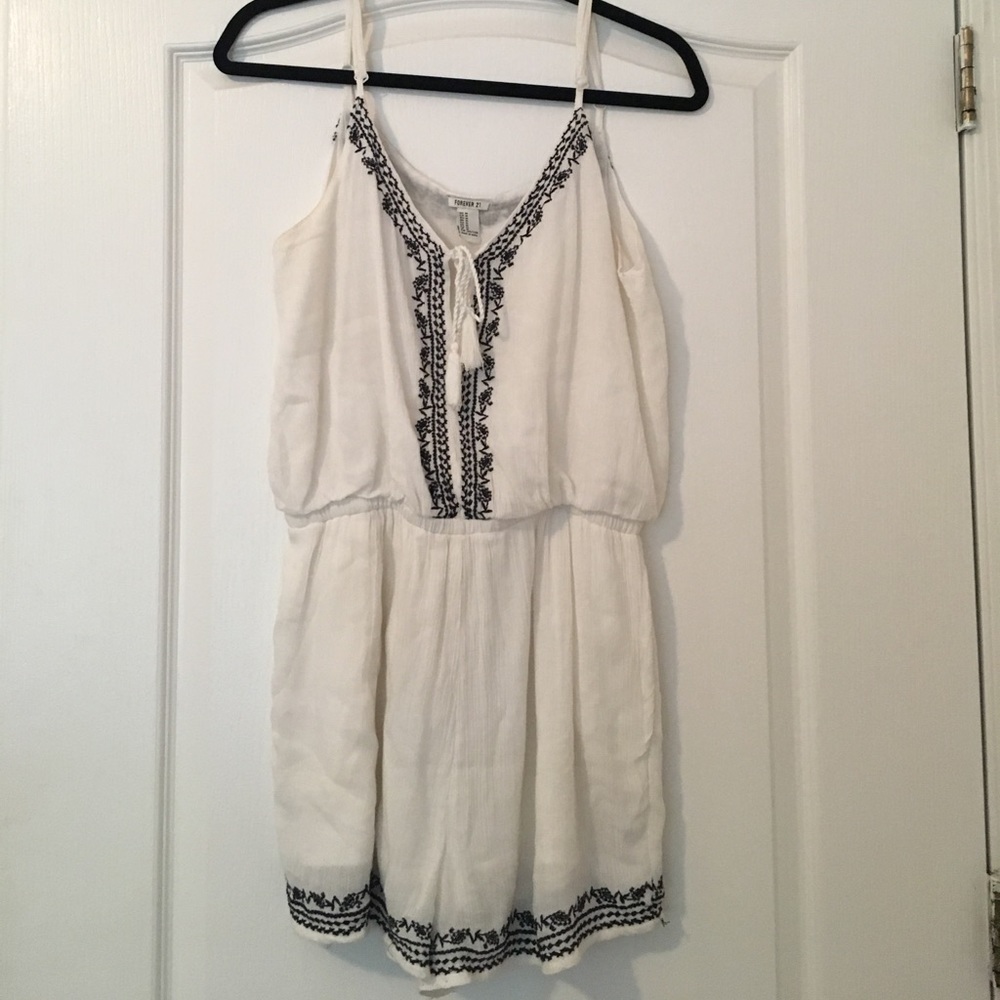 White romper with black lacing