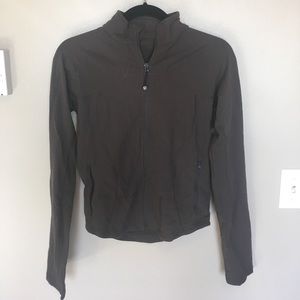 Brown fitted Lululemon pullover.