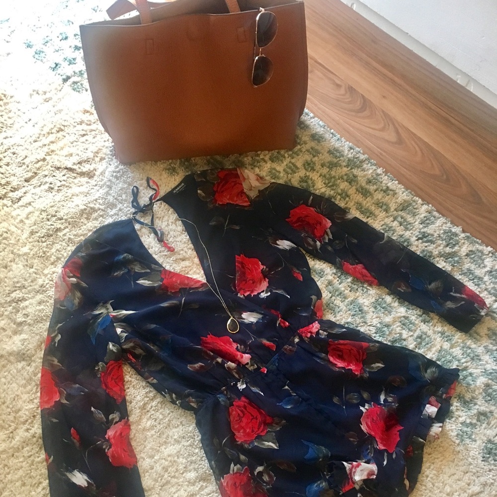 Floral Romper - Ruffle Hem. Navy Blue in color