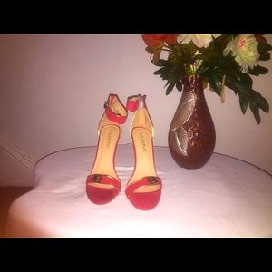 Ruby red heels with gold trimming
