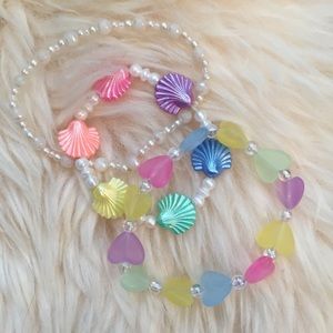 3 Rainbow plastic bracelets