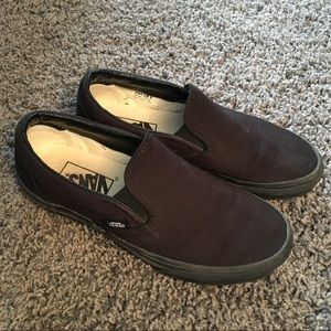 All black slip on vans