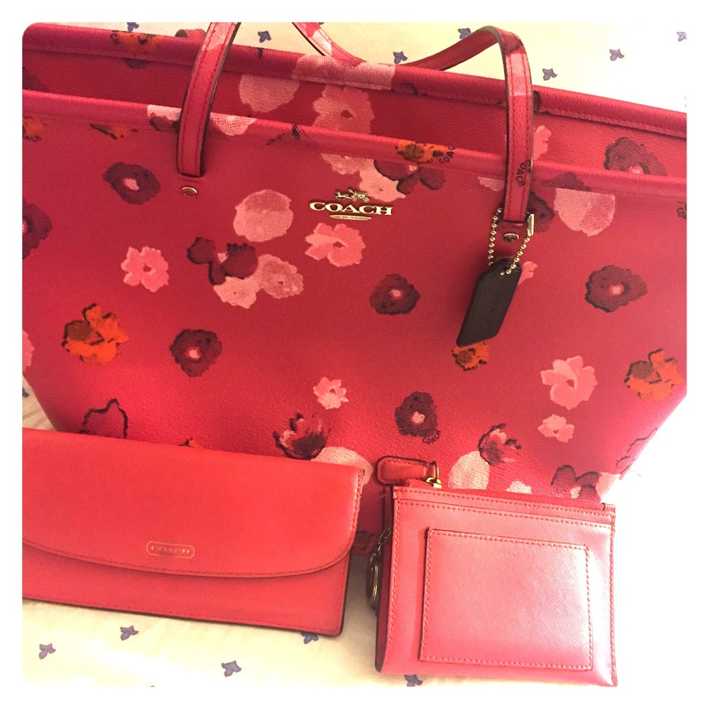 Coach pink tote and two Coach wallets