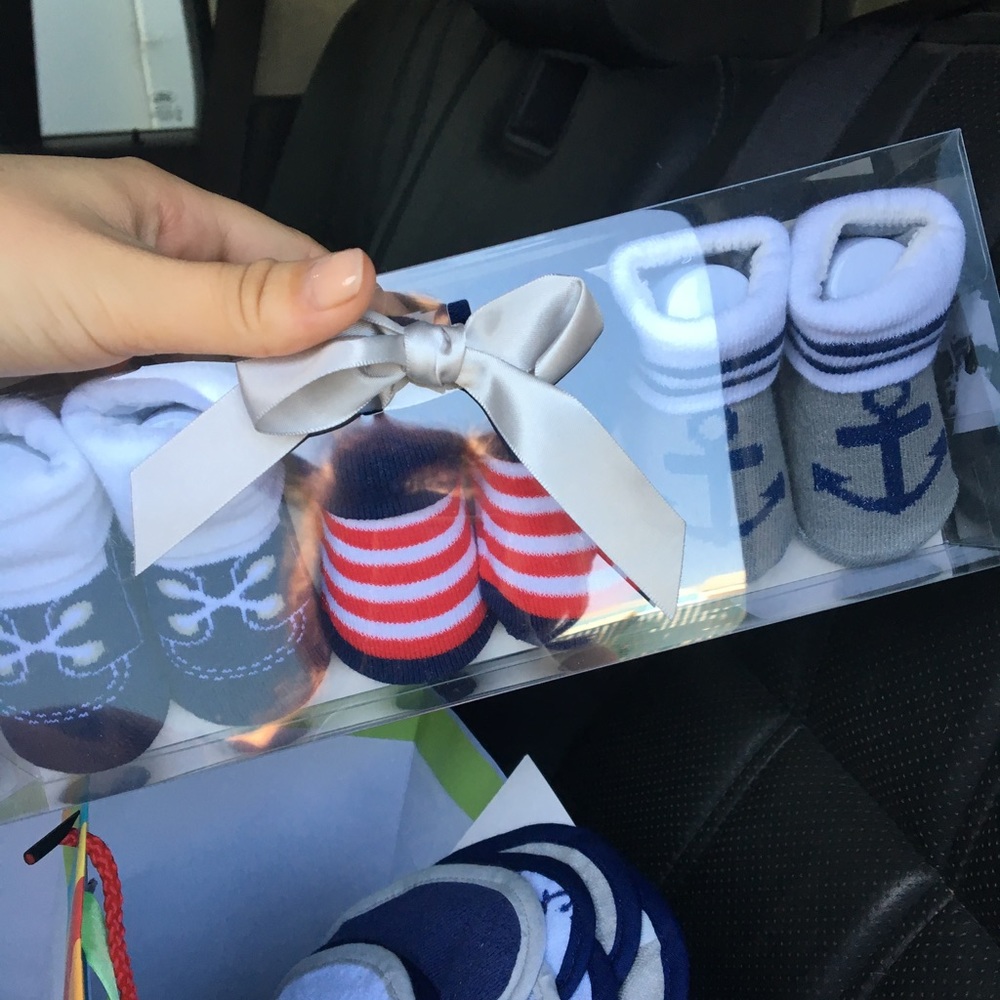 Baby booties, wash cloths, bibs and onesies