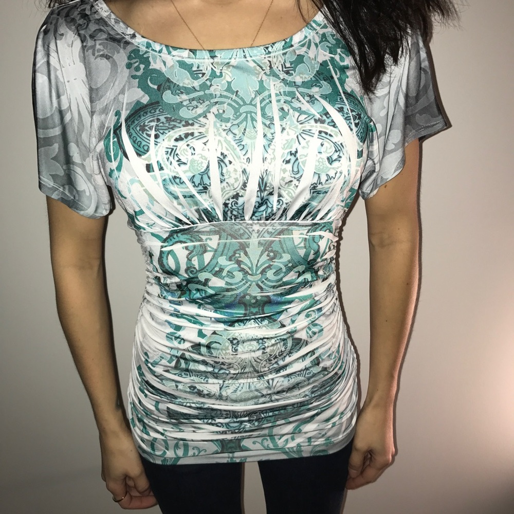 White top with green detail