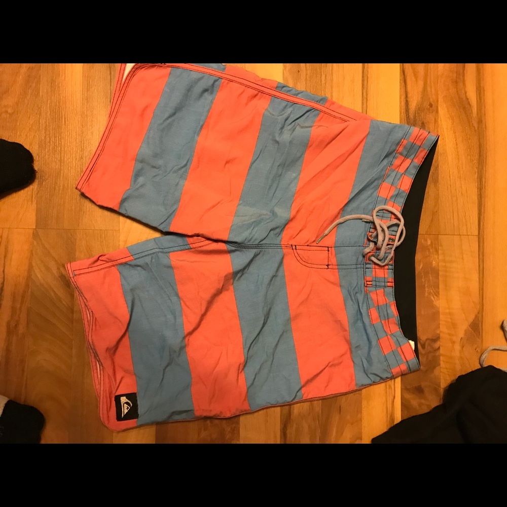 Quicksilver swim trunks board shorts.