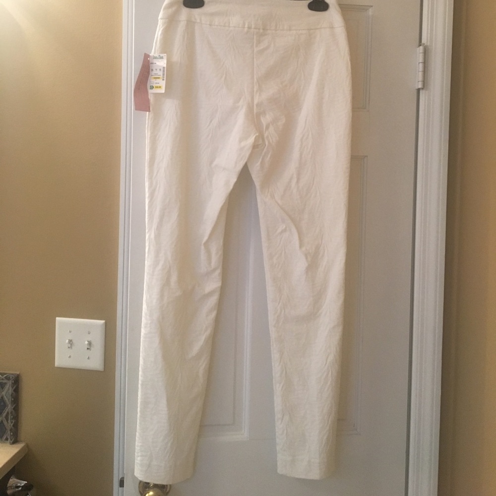White stretchy pants, subtle designs
