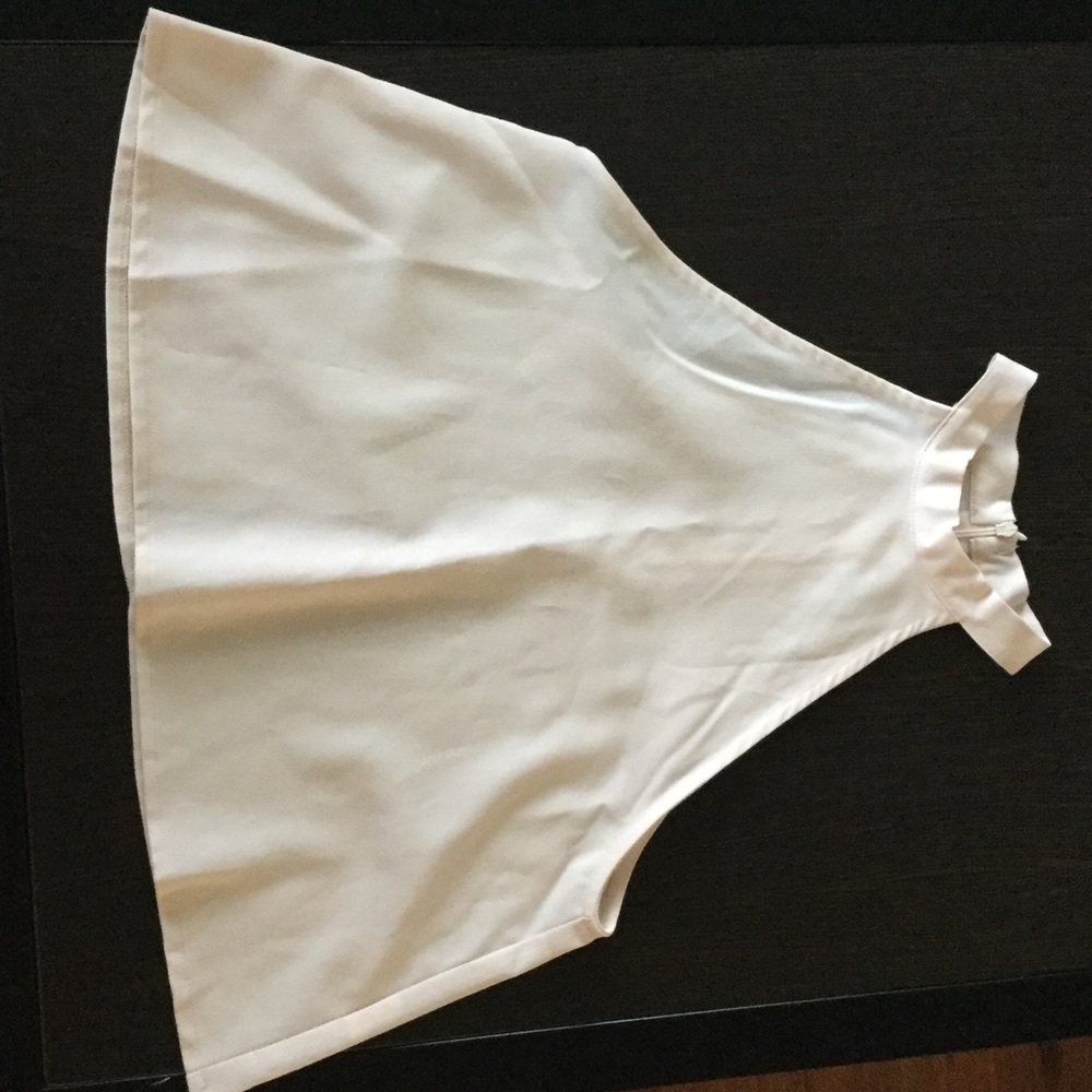 Cream sleeveless shirt