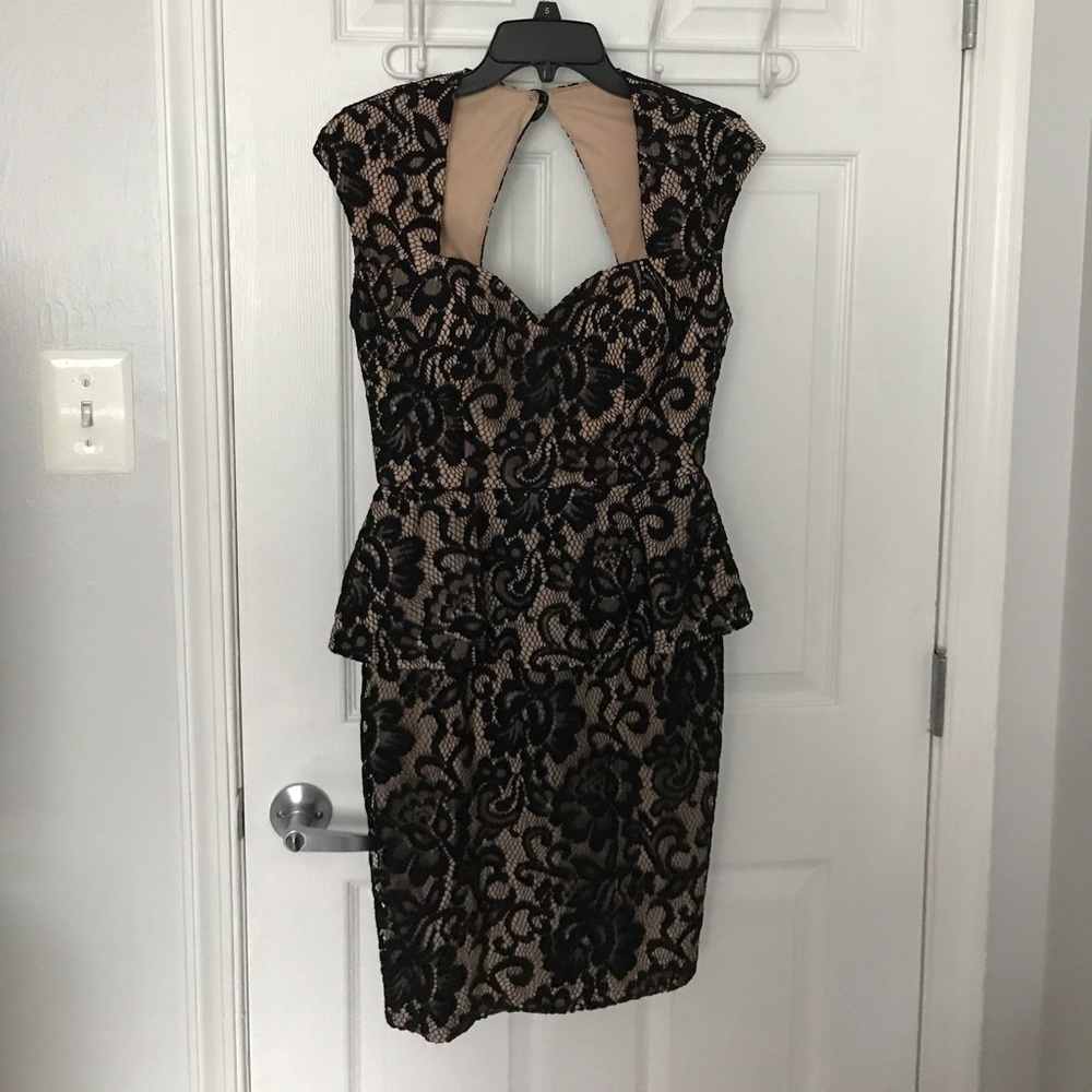 Black lace peplum cap sleeved dress