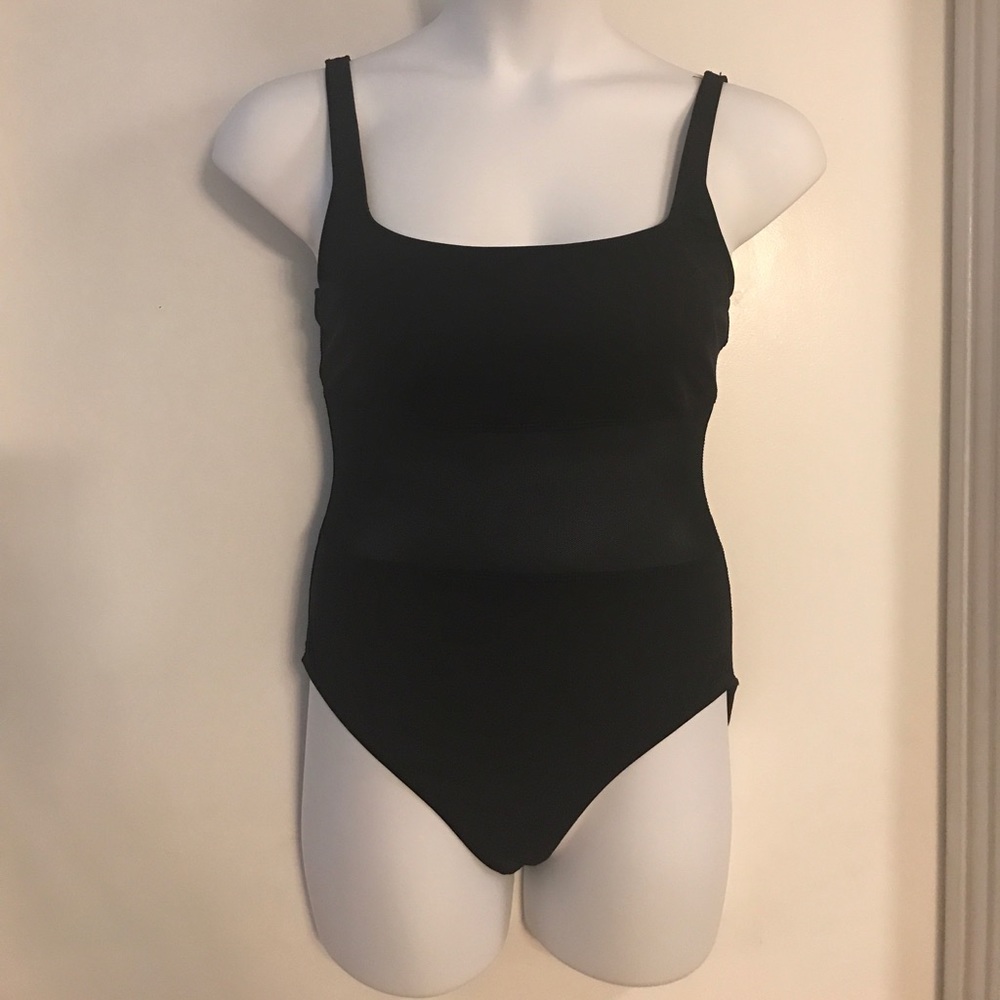Black swimsuit w/ see thru mesh by Rod Beattie.