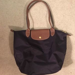 Longchamp Le Pilage shoulder tote in plum.