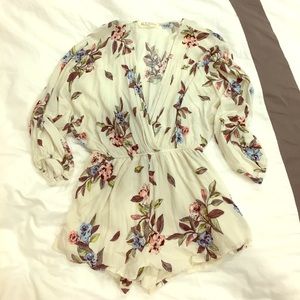 Floral cream colored feminine romper