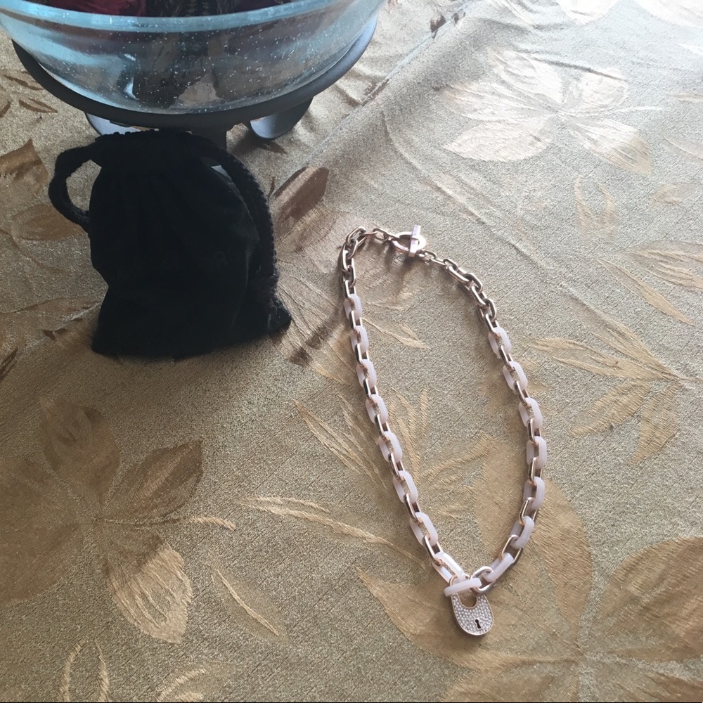 Michael Kors rose gold necklace comes with pouch