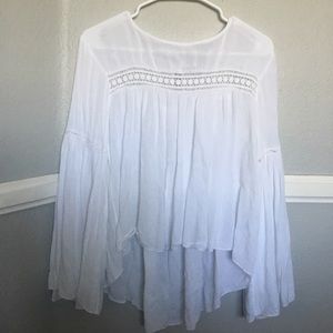 A white long sleeve flowy shirt