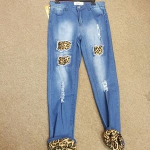 Blue boyfriend jeans with cheetah print rips