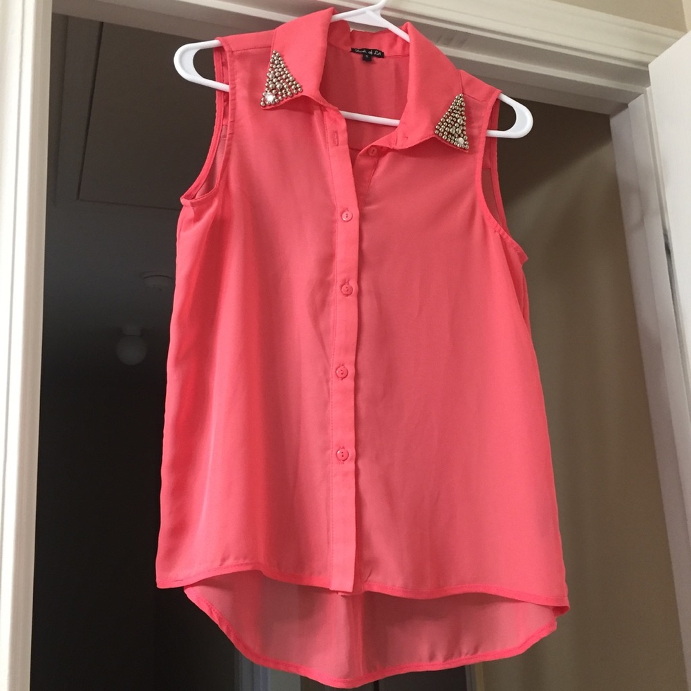 Orange sleeveless blouse with beaded detail