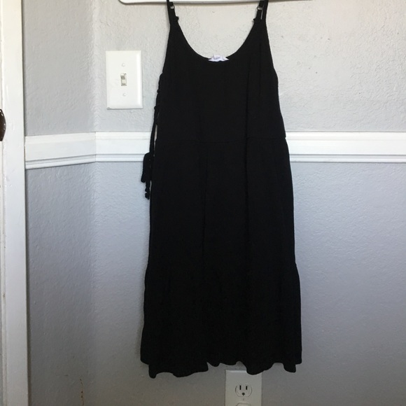 A black dress with side tie up details - Picture 1 of 3