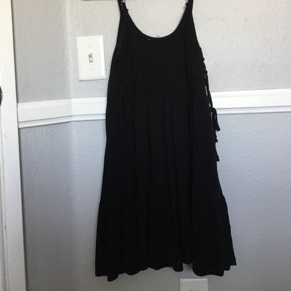 A black dress with side tie up details - Picture 3 of 3