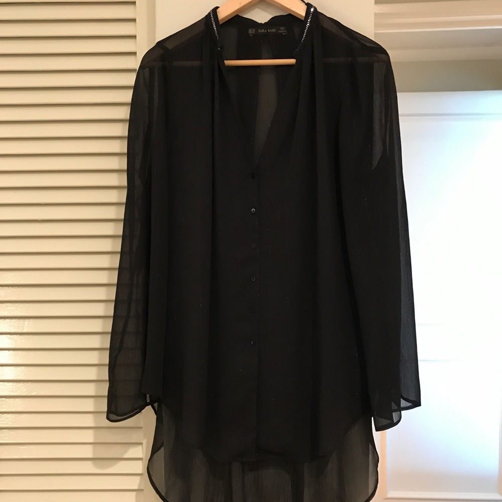 Zara black blouse with shimmering lines.