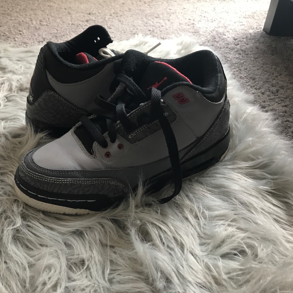 Grey, black and red Jordan's