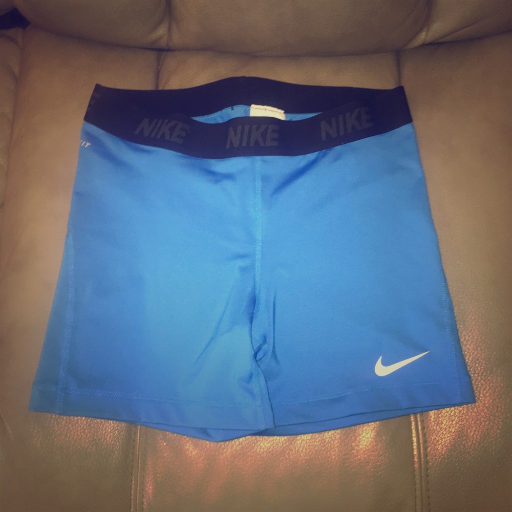 Nike dri fit blue spandex shorts size large.